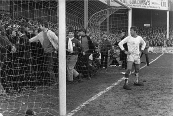 Fans pitchside after wall collapse